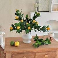 Vente en gros de branches de citron artificielles réalistes et réutilisables, aspect naturel, feuillage de faux citron pour arrangements floraux