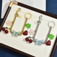Pendentif de sac en alliage de zinc, motif cerise, papillon, trèfle, cœur, bicolore or et argent, ornement de sac fleur, porte-clés tendance