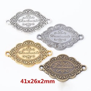 ملصق خياطة مخصص ثلاثي الأبعاد من سبائك الزنك، علامة معدنية منقوشة يدويًا مع شعار للحقائب والمحافظ وحقائب الظهر - Product Image 2