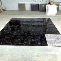 Carreaux de sol brillants antibactériens 600x600mm noir et or à motifs floraux et veines dorées pour la décoration d'appartements et de centres commerciaux