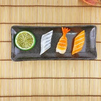 Ensemble de vaisselle en céramique personnalisé par le fabricant, assiette à sauce noire avec tapis en bambou et baguettes pour restaurant occidental