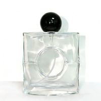 Flacon de parfum en verre transparent carré de haute qualité, personnalisable, avec bouchon rond noir pour l'emballage de parfum