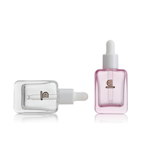 Flacon compte-gouttes en verre transparent rose à fond épais de 30 ml vide en gros pour l'emballage cosmétique