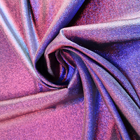 Tissu en polyester bicolore brillant et changeant de couleur, avec teinture métallisée, idéal pour la confection de vêtements tendance.