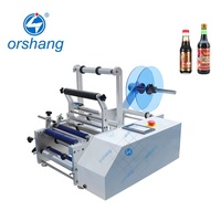 Moteur électrique Orshang PLC semi-automatique petite étiqueteuse de bouteilles écran tactile haute vitesse pour eau minérale huile d'olive