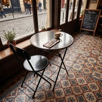Chaise pliante minimaliste moderne en fer forgé avec dossier, forte capacité de charge ; idéale pour la restauration commerciale et les salons de thé.