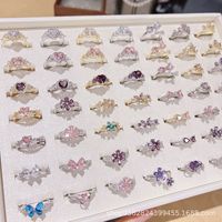 Bague ajustable de style français, luxe léger, design de niche, plaquée or cuivre, avec accents de zircon et motif floral papillon émaillé