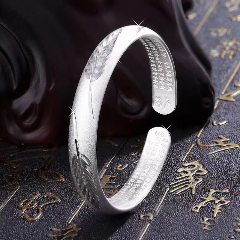 Corazón de pluma, chapado en plata gruesa tipo Sutra.