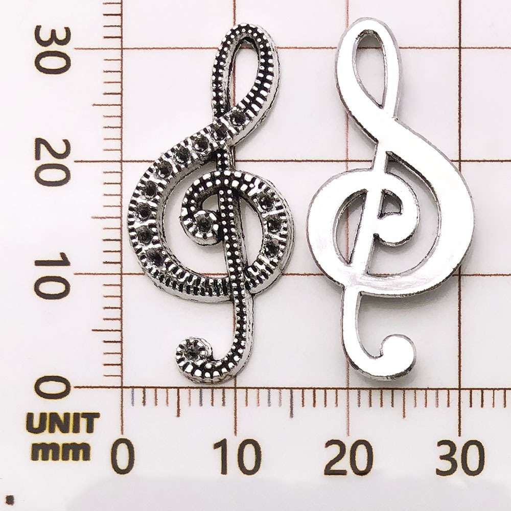 1 note de musique antique en argent - 2g - 15*33mm - 7410