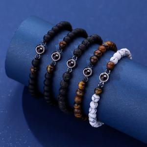 Bracelet de perles synthétiques pendentif de style européen américain 100 langues Bracelets à maillons de chaîne de mode photo haute définition - Product Image 1