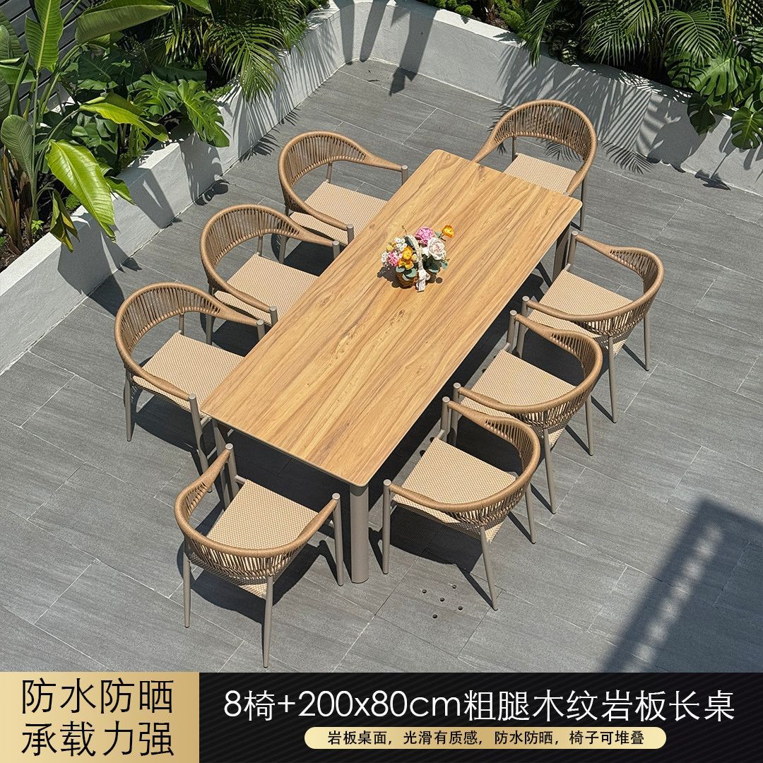 Mesa larga de losa de 200x80mm con 8 sillas.