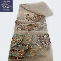 Tissu en maille brodé de sequins et de perles à motifs floraux de grands papillons pour robes de soirée et robes de cérémonie