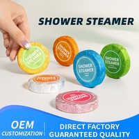 Tablettes de douche aromatiques OEM pour salle de bain, parfum de bain hôtelier 30g, hydratantes et régulières en matière d'huile, emballées individuellement