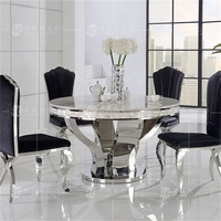 Ensemble de salle à manger avec table ronde en marbre de 120 cm et 6 chaises en cuir véritable