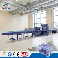 Machine d'emballage sous film rétractable à grande vitesse de type linéaire entièrement automatique pour eau minérale avec contrôle PLC