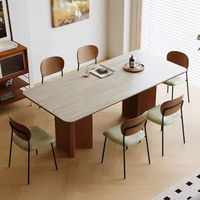 Table à manger au design moderne avec plateau rectangulaire en pierre frittée et base unique pour salle à manger