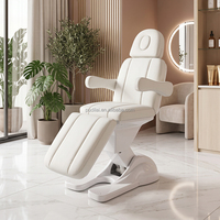 Lit de beauté électrique multifonctionnel en cuir côtelé blanc avec moteur, appui-tête amovible, base LED pour salon, spa, soins du visage