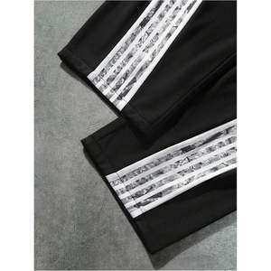 Pantalon de survêtement ample pour homme, coupe large, taille élastique avec cordon de serrage, style streetwear, avec bande latérale, respirant, en polyester et coton - Product Image 4