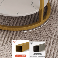 Table basse elliptique moderne de luxe léger en faux marbre avec cadre en métal doré et étagère pour salon