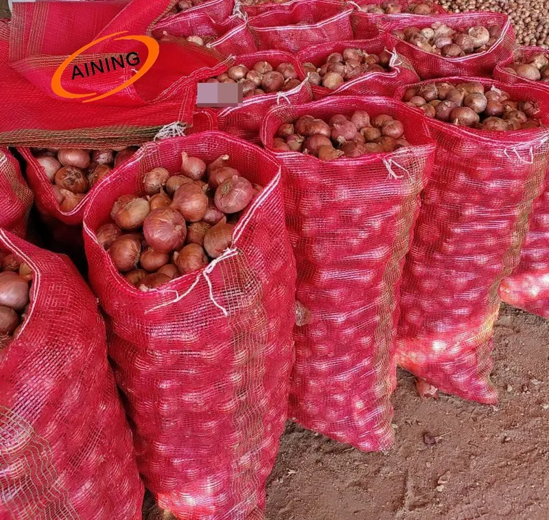 Rete di plastica produrre sacchetti per frutta e verdura con rosso verde giallo colore arancione