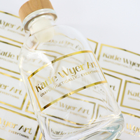 Feuille d'étiquettes en feuille d'or transparente personnalisée pour l'emballage de bouteilles en verre Autocollants de logo privé auto-adhésifs