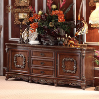 Ensemble de meubles de salle à manger classiques européens de luxe avec table ronde en bois massif, chaises rembourrées et détails sculptés à la main