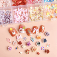 Meilleure vente en vrac 3D Rose fleurs papillon arc perle camélia résine ongles breloques bijoux accessoires Kawaii 24 grille ongles breloques
