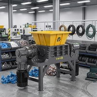 Broyeur de déchets plastiques à double arbre pour matériaux mixtes, y compris le caoutchouc, le bois, le nylon, l'ABS, le PC et les câbles.