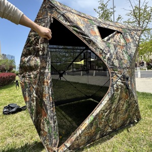 Refugio de Caza Panorámico 360° con Visión Unidireccional, Malla de Camuflaje, para una Temporada Exitosa de Caza de Ciervos y Pavos - Product Image 1