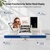 Support d'affichage interactif pliable blanc pour lunettes intelligentes avec panneau arrière personnalisé, miroir d'essayage intégré, panneau de commande et rangement