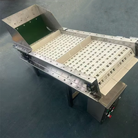 Transportador de cinta modular con deflector para transportar cubitos de hielo Filtrado automático de escoria de hielo y transportador de material de elevación