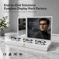 Expositor de Mostrador Blanco Brillante para 3 Pares de Gafas con Espejo de Prueba Integrado, Panel de Cartel Intercambiable y Soporte Flexible para Gafas