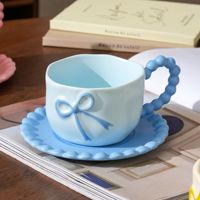 Ensemble tasse à café et soucoupe en céramique moderne Dingyue en forme d'arc avec poignée, idéal pour le petit-déjeuner féminin et l'utilisation au bureau, coffret cadeau