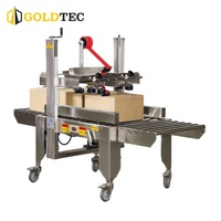 Machine d'emballage semi-automatique en acier inoxydable Goldtec GTF-5050G pour la fermeture de grandes boîtes en carton
