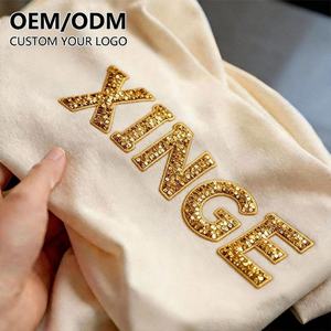 Nouveau T-shirt tendance 2026 style américain avec imprimé strass doré estampé à chaud, T-shirt homme en coton coupe oversize et courte style streetwear - Product Image 1