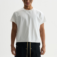 T-shirts d'été en coton 230 g/m² blancs à col rond, coupe ample et courte, avec bas et manches effet usé, pour hommes, vente en gros