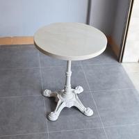 Table de salle à manger moderne en marbre français avec base en fonte ornée, écologique, imperméable, pour restaurants et cafés en extérieur