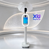 Xingruijia XRJ-cmp Photomaton ovale en métal à impression instantanée, écran tactile 14 pouces, appareil photo, impression en libre-service, ventilateurs de refroidissement RGB, détachable