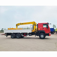Camion grue Sinotruk Howo 6x4 d'occasion, en bon état, pour le transport de charges lourdes dans la construction