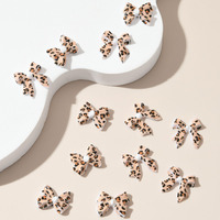 50 pièces de nœuds en ruban en résine à imprimé léopard, accessoires de nail art aux tons doux automne/hiver, personnalisés et prêts pour les fêtes