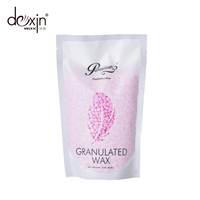 Perles de cire de colophane rose perle rose OEM cire chaude dépilatoire pour l'épilation visage lisse zone de bikini sacs emballés à la noix de coco aloès