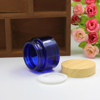 Bouteille de conservation en verre écologique de 50g avec couvercle en bambou, design moderne, empilable, compatible lave-vaisselle, préservation de la fraîcheur pour les entreprises