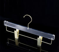 Neuheiten Neues Design Großhandel Transparenter Acryl-Kleiderbügel mit Goldclips für Bekleidungsboutiquen und Einzelhandel