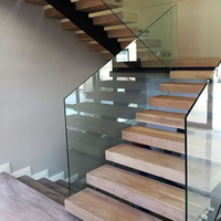 Escalier d'angle en chêne à poutre unique en acier au carbone avec main courante adapté aux villas et appartements
