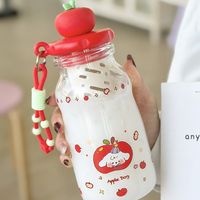 Bouteille d'eau mignonne avec motif de chien de dessin animé sur le couvercle en forme de pomme