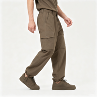 Pantalon cargo homme olive foncé à jambe large, poches à rabat, cordon de serrage à la cheville, revers ajustables, fermeture éclair discrète, style Techwear Urbain et Extérieur