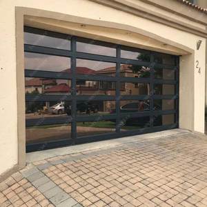 Sunnysky Portes <span class=keywords><strong>de</strong></span> <span class=keywords><strong>garage</strong></span> électriques Portes <span class=keywords><strong>de</strong></span> <span class=keywords><strong>garage</strong></span> en aluminium pour maisons Sectionnel électrique bon marché Métal Verre Acier inoxydable Moderne - Product Image 1