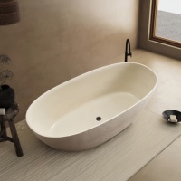 Nouvelle arrivée : Baignoire autoportante moderne en pierre texturée, couleur beige mat, forme ovale, baignoire de luxe pour villa