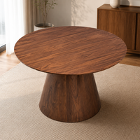 Table à manger ronde sur piétement conique massif, placage en bois de noyer, plateau fixe en MDF