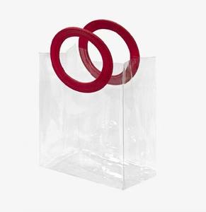 Bolso de Mano Transparente de PVC con Asa Redonda, Moderno y Elegante - Product Image 1